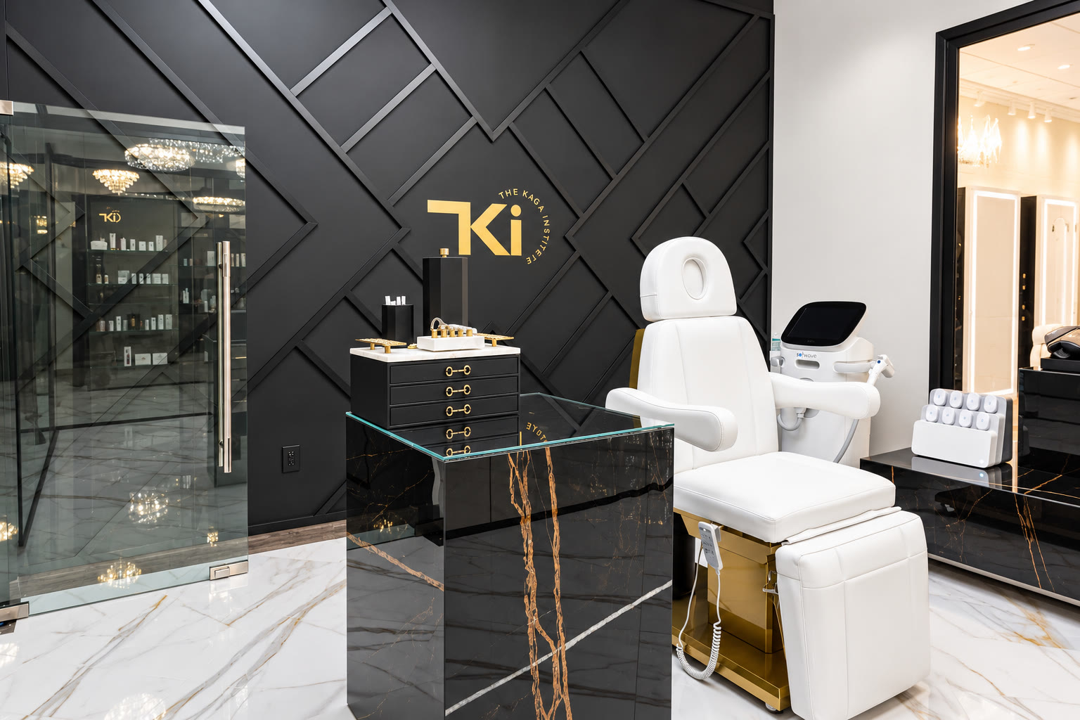Treatment suite with a black geometric wall and a white treatment chair