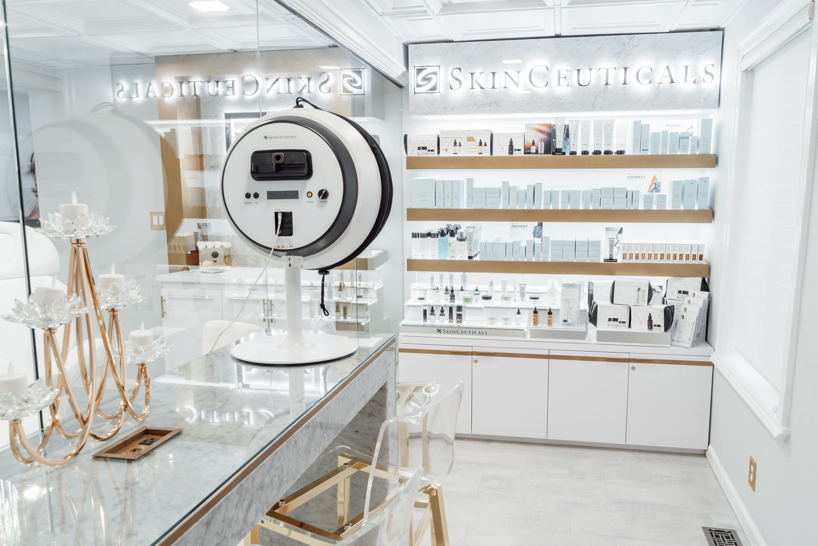 Skin analysis device beside the SkinCeuticals skincare bar