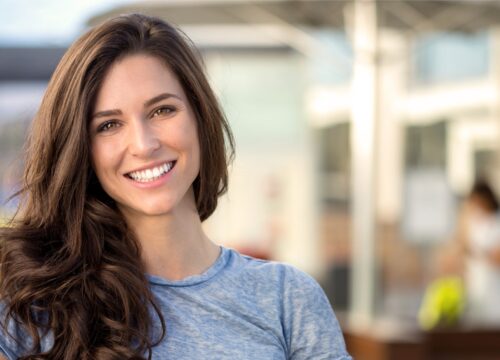 Photo of a brunette woman with great skin after Evoke treatments