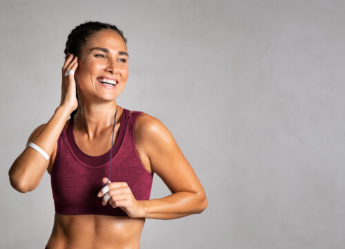 Photo of a happy woman in workout clothes