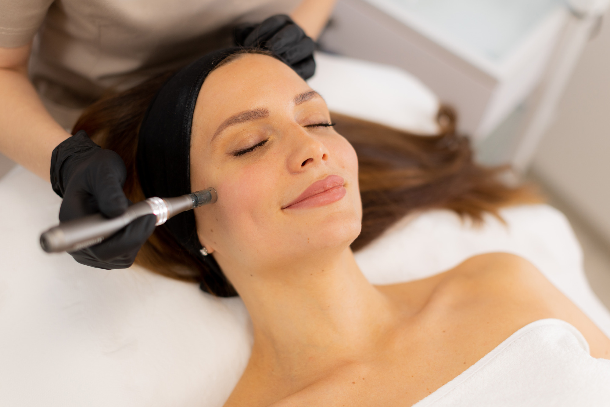 Photo of a woman getting concierge aesthetics services