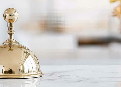 Image of a concierge bell at boutique