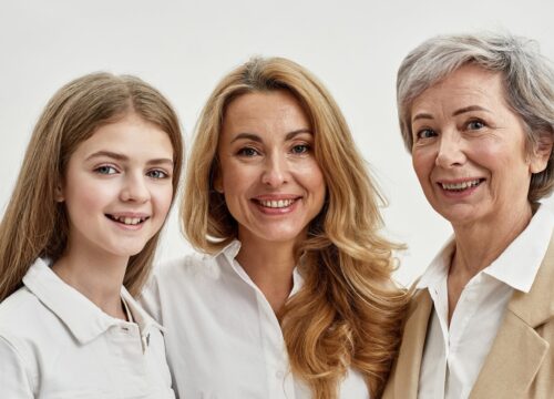 Grandma, mother and kid hug and look at camera